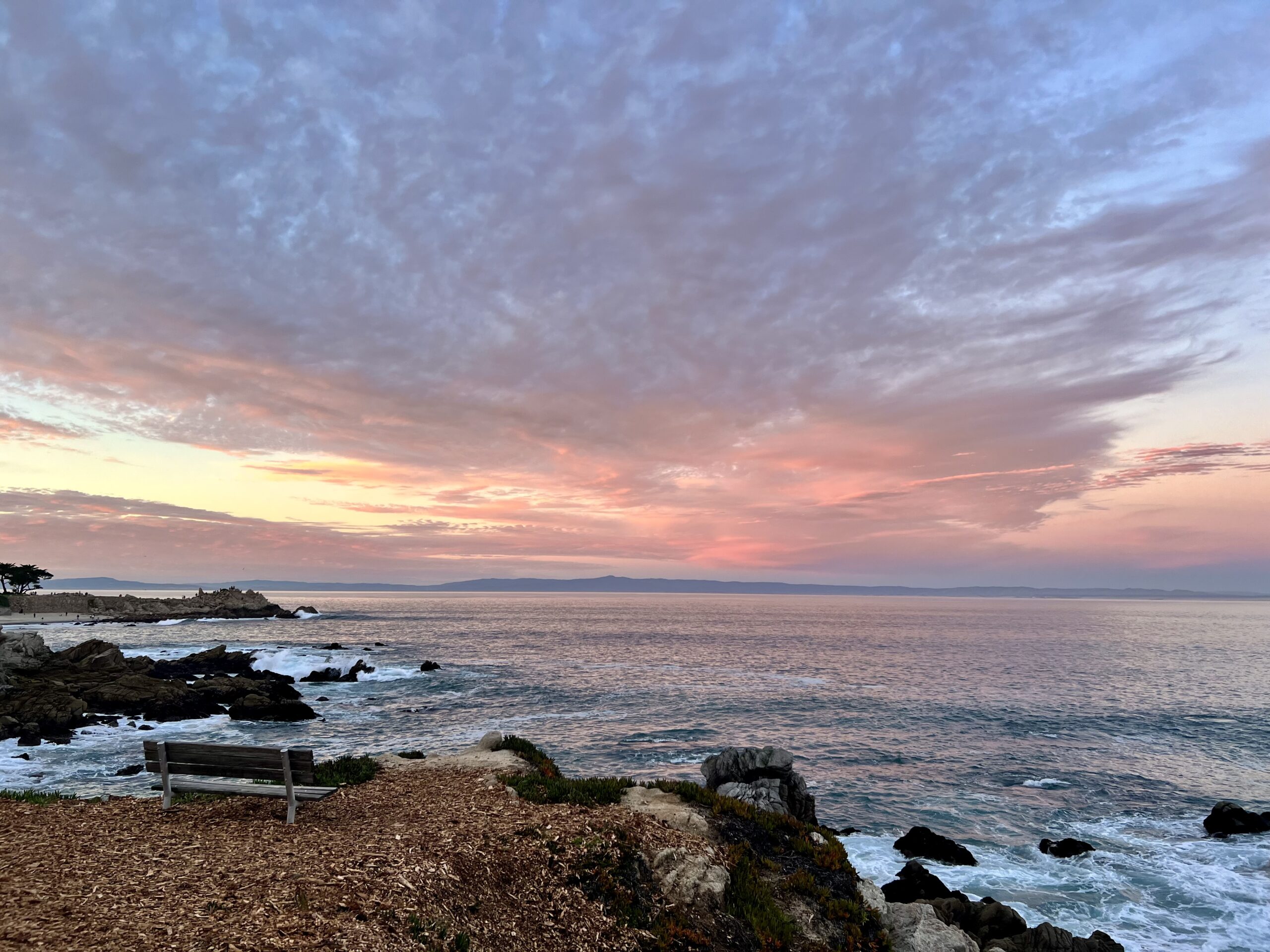 Peaceful Monterey coastline at sunset with ocean waves and scenic overlook, representing the tranquil setting for IFS therapy and healing